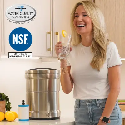 Woman drinking filtered water — Triple NSF Certified
