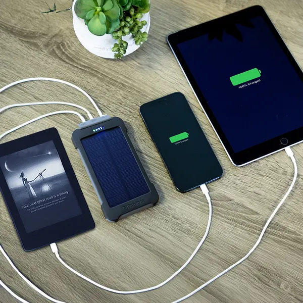 Patriot Power Cell CX charging a Kindle, smartphone, and tablet simultaneously
