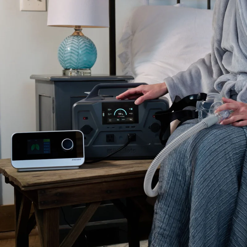 PPG-1200 powering a CPAP machine on a bedside table at night