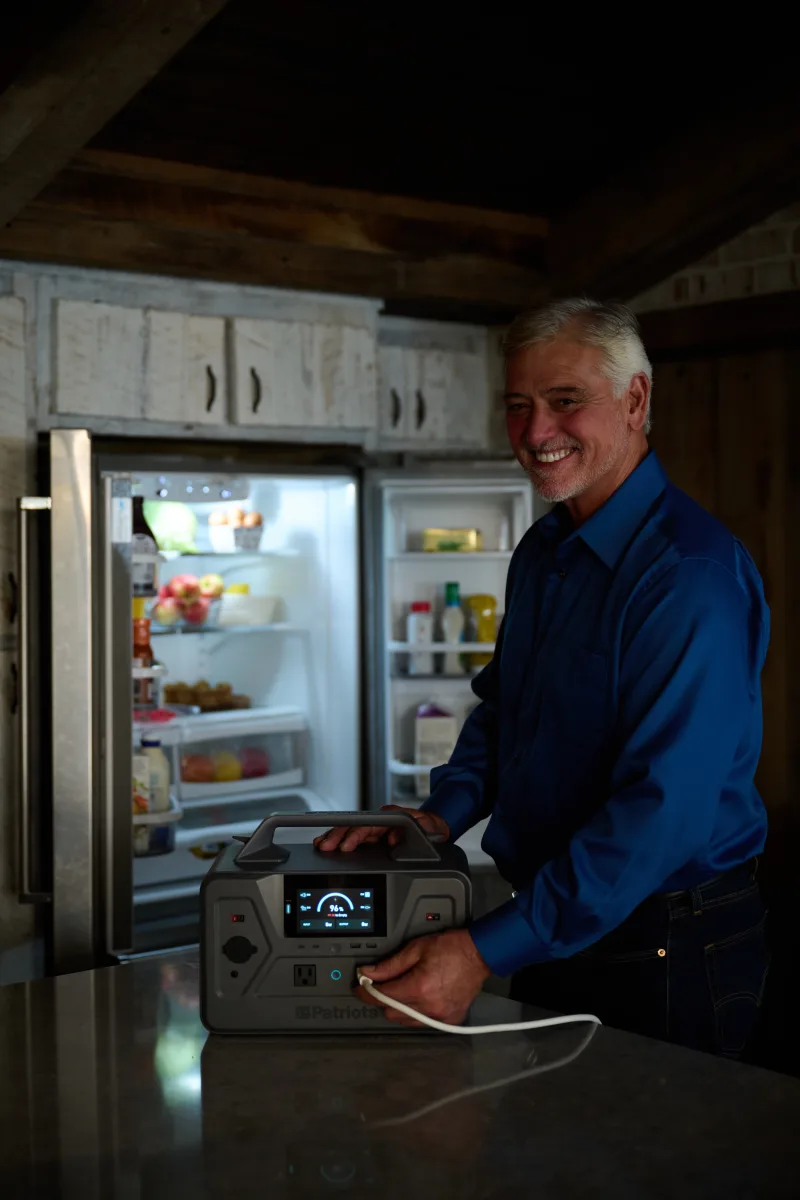 PPG-1200 powering a refrigerator in a sunlit kitchen during a power outage