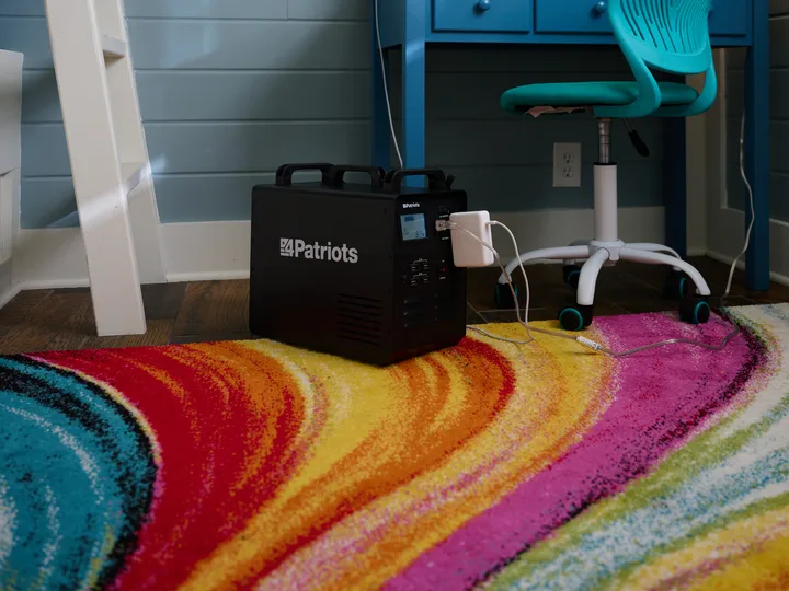 Patriot Power Generator 1800 charging a laptop in a kids room