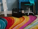 Patriot Power Generator 1800 charging a laptop in a kids room